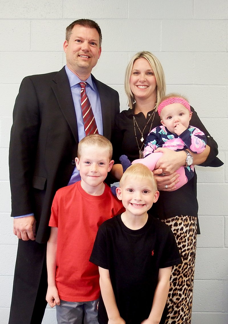 TIMES photograph by Annette Beard New Blackhawk Athletic Director Kevin Ramey and his wife, Lindsay, and children, Coleman, 7, Carson, 6, and Harper, 9 months, were introduced at the Monday night School Board meeting.