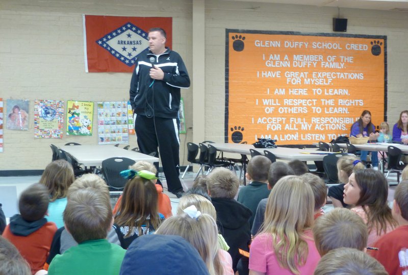 Submitted photo Greg White, boys&#8217; basketball coach at Gravette High School, was guest speaker for the April Rise and Shine assembly at Glenn Duffy Elementary School. He spoke to the students about accountability and how they must be responsible for their actions in the classroom, on the court and at home. He said accountability could be wrapped up in three words: own your outcome.