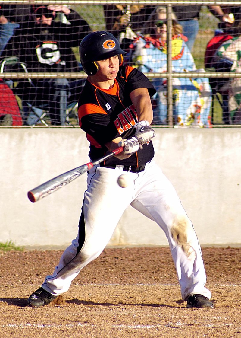 File Photo by Randy Moll Dylan Gruver, of Gravette, takes a cut at a pitch during a recent home game.