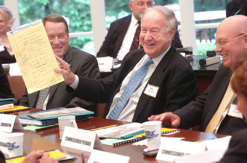 Ray Thornton, who served in a wide range of roles in Arkansas, holds up a pad of notes at an organizational meeting of the Arkansas Lottery Commission on May 5, 2009, when he was interim commissioner. 