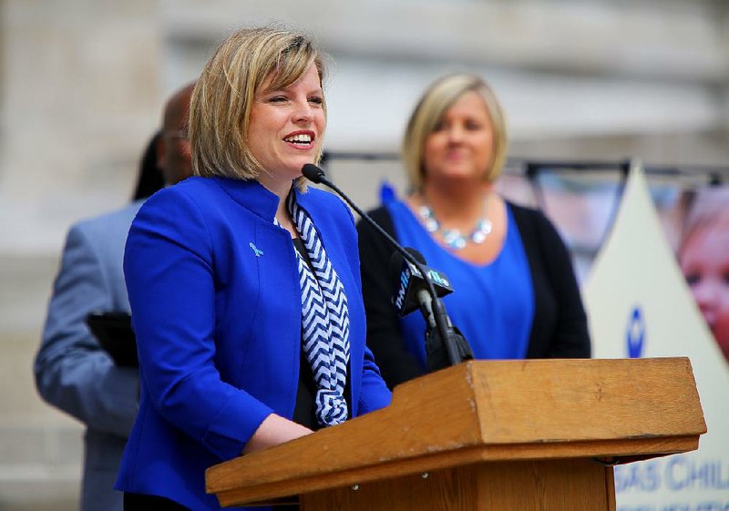 Mischa Martin, interim director of the Division of Children and Family Services, speaks during a rally against child abuse Thursday at the state Capitol. The rally was held to observe Child Abuse Prevention Month.