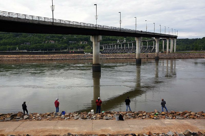 Arkansas Democrat-Gazette/MITCHELL PE MASILUN --4/14/2016--
Fishermen hope for a catch at the Big Damn Bridge Thursday, April 14, 2016