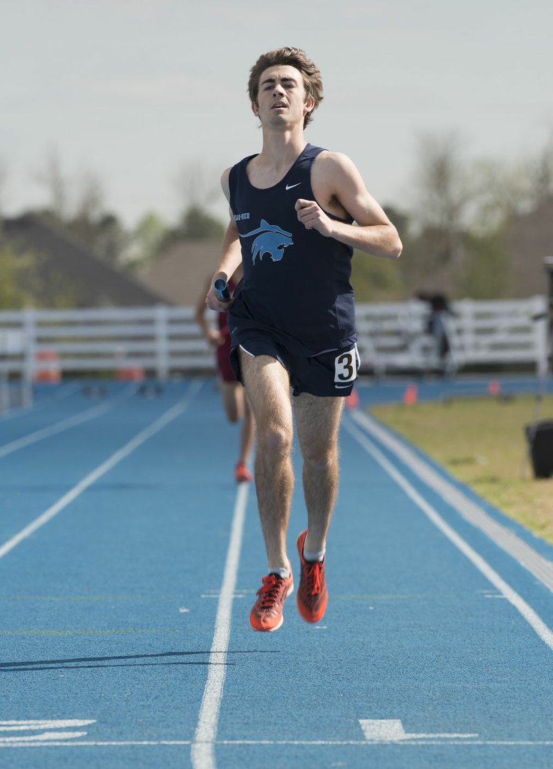 T.J. Sugg of Springdale Har-Ber finishes the 4x800 meter relay Thursday at the Joe Roberts Invitational track meet at Springdale Har-Ber. Har-Ber won the race in 8:15.041.