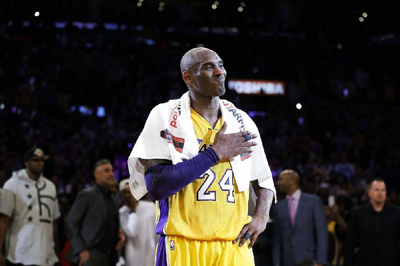 Los Angeles Lakers guard Kobe Bryant had no problem signing autographs for teammates, except for Nick Young, who handed the Nike pitchman a pair of Adidas shoes.