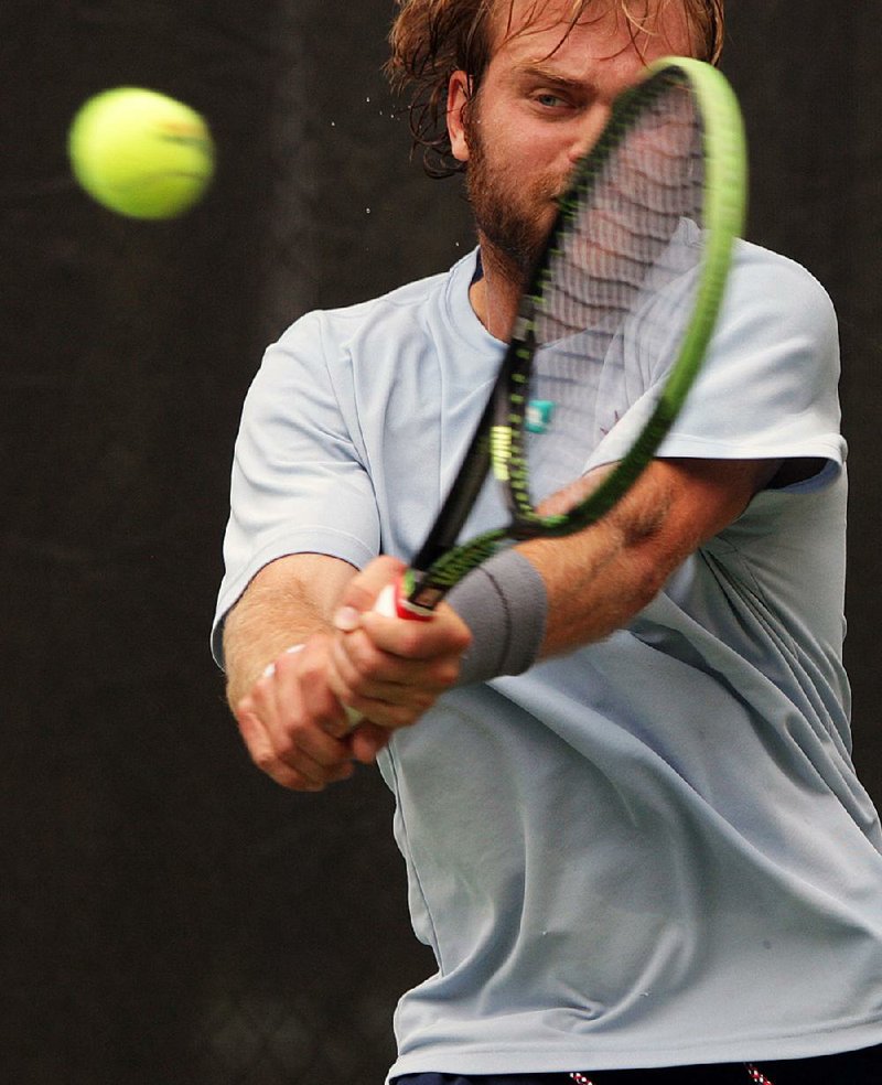 Dennis Nevolo returns a shot to Philip Bester during the quarterfinals of the Baptist Health Bolo Bash on Friday at Rebsamen Tennis Center in Little Rock. Nevolo won 24 of 32 points in the first set to eventually crush Bester 6-0, 6-1 and move into today’s semifinals.