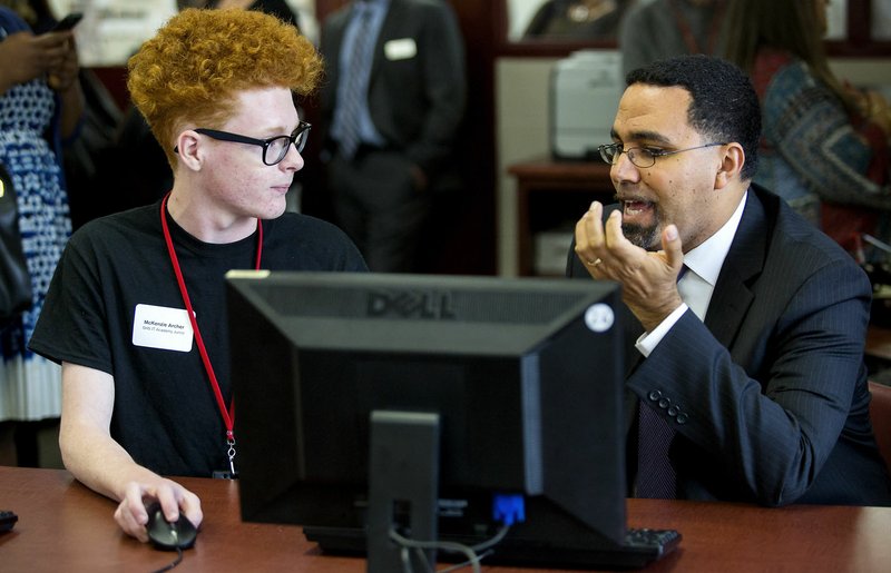 U.S. Secretary of Education John King talks with Springdale High School junior McKenzie Archer during a visit to the Northwest Arkansas school Friday.