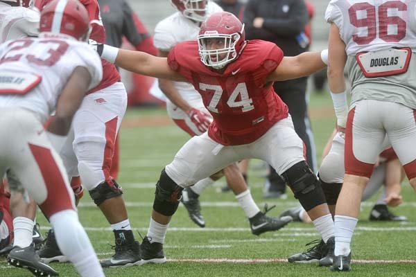 Arkansas offensive lineman Colton Jackson (74) runs drills Saturday, April 16, 2016, during practice at Razorback Stadium in Fayetteville.