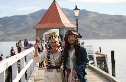 Bride Marianna Fenn and bridegroom Toby Ricketts stand on a jetty in Akaroa harbor, New Zealand on Saturday April 16, 2016. New Zealand hosted the world’s first Pastafarian wedding, conducted by the Church of the Flying Spaghetti Monster. 