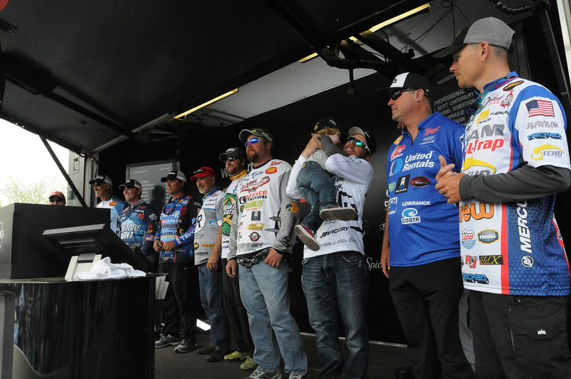 Top 10 anglers who will fish today gather on stage Saturday after the weigh-in. They include Andy Morgan (second from left), Jeff Sprague (third from left), Scott Martin, (fourth from left) Darrel Robertson (fifth from left), Stetson Blaylock (third from right) and Chris Whitson (second from right).