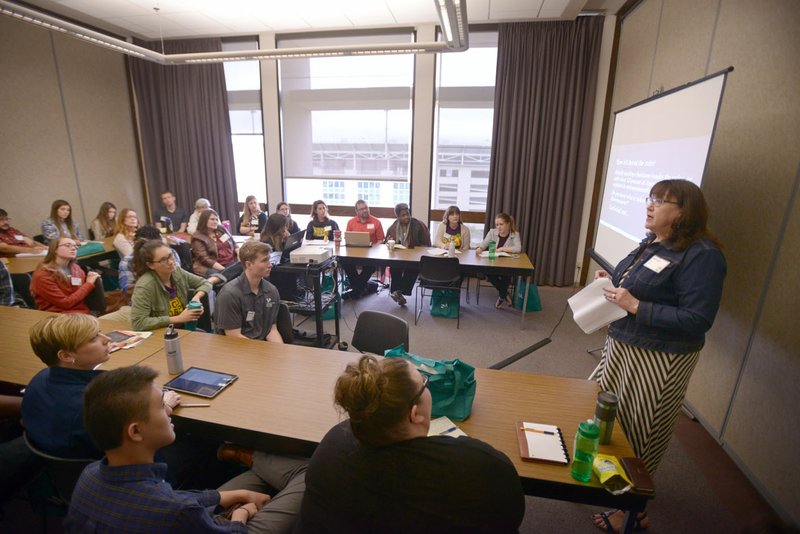 Janet Davas with Hatch LLC talks Saturday during the Campus Kitchen Project's Food Waste & Hunger Summit in the Arkansas Union in Fayetteville.