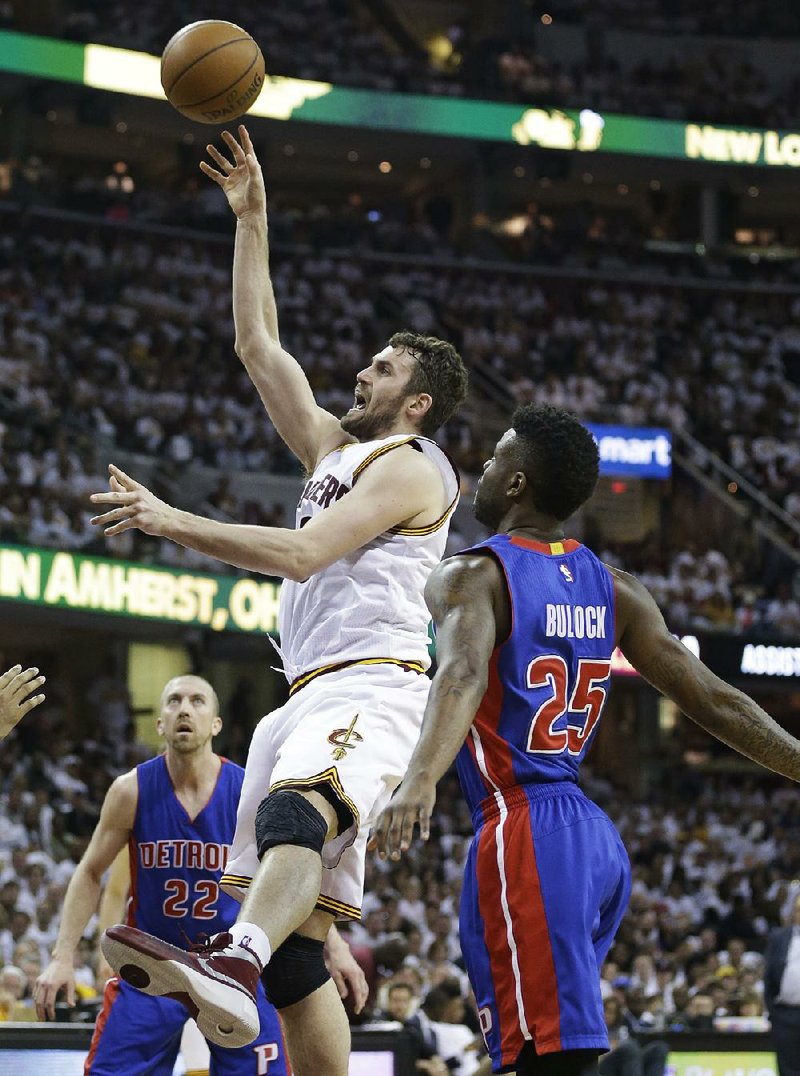 Cleveland Cavaliers forward Kevin Love (0) shoots against Detroit Pistons defender Reggie Bullock (25) during the first half of Sunday’s NBA playoff game in Cleveland. Love finished with 28 points and the Cavaliers won 106-101.