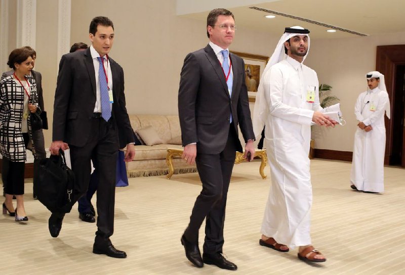 Russian Energy Minister Alexander Novak (center) arrives at an oil producers’ meeting in Doha, Qatar, on Sunday.