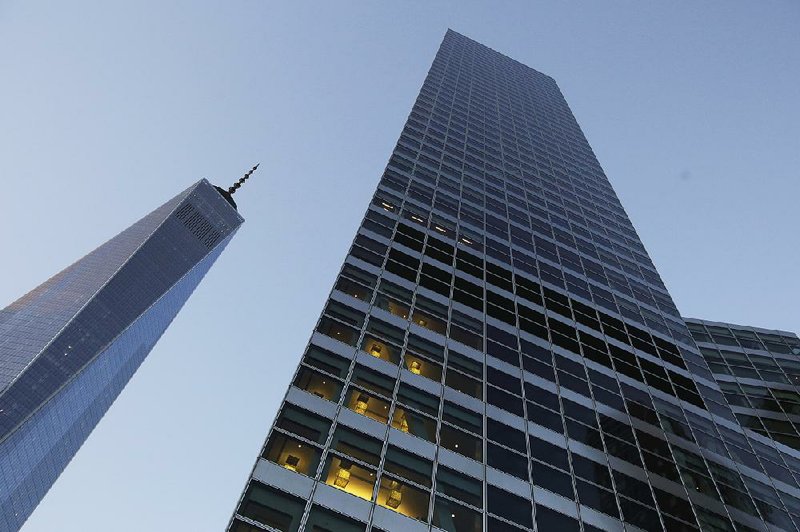 Goldman Sachs headquarters in lower Manhattan stands next to One World Trade Center (left) in this file photo. 