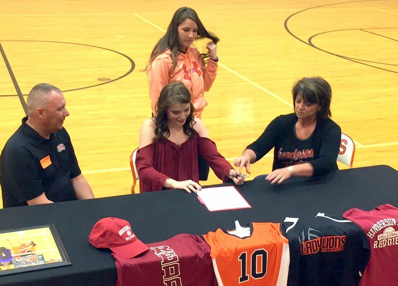 Submitted Photo Shannon McKnight signs a letter of intent to play volleyball for Henderson State University at a signing event on April 13 at Gravette High School.