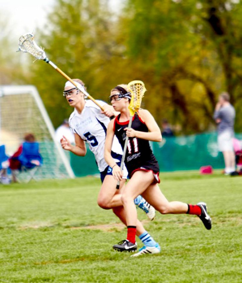 Submitted Photo Samantha Roth, a senior at Gravette High School, signed a letter of intent last Wednesday to play lacrosse at Rockhurst University in Kansas City, Mo. Here Sam, No. 11 on the Black Diamonds girls&#8217; lacrosse team, is seen driving to the goal in one of her games in the Northwest Arkansas Lacrosse Club. She has played all positions on the team.