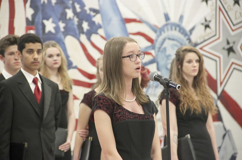 Taylor Beavers, a senior at Farmington High and a member of Crimson Select Ensemble, sings a solor at the Chamber&#8217;s annual banquet last week.