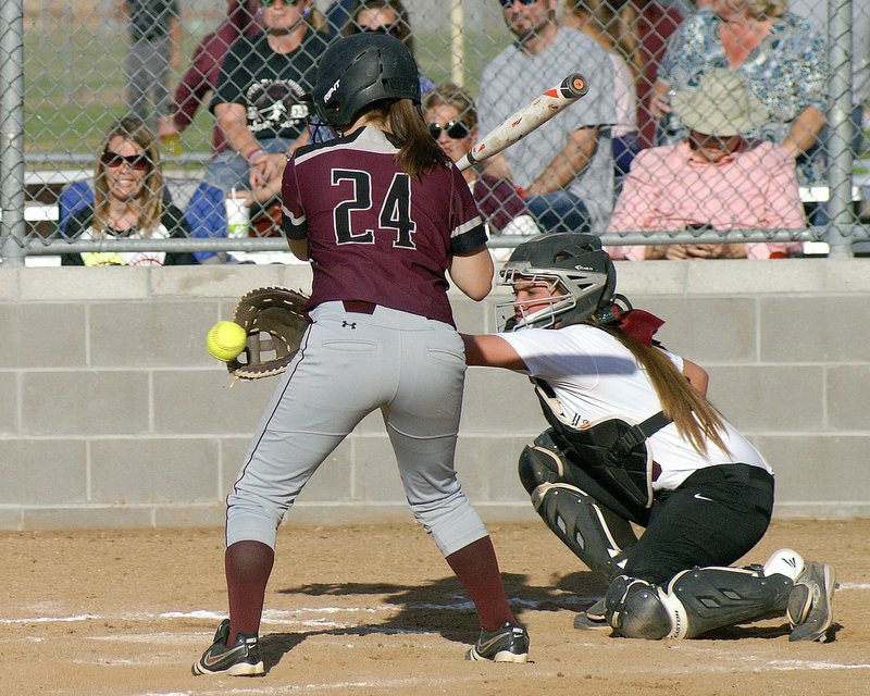 Photo by Randy Moll Taylor Hull, catcher for the Lady Pioneers, reaches out in front of a Lincoln batter to grab a pitch during play in Gentry on Thursday.