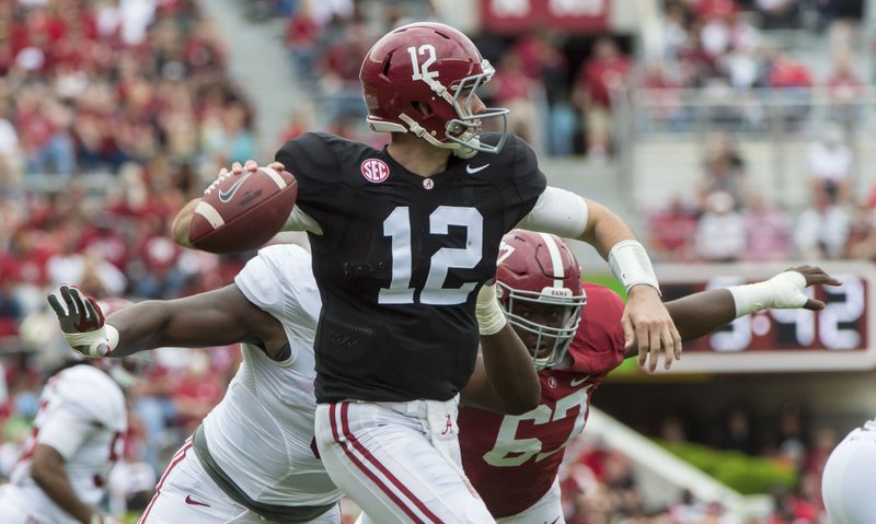 Alabama quarterback David Cornwell (12) rolls out under pressure during the second half of the NCAA college football team's A-Day spring game, Saturday, April 16, 2016, in Tuscaloosa, Ala. 