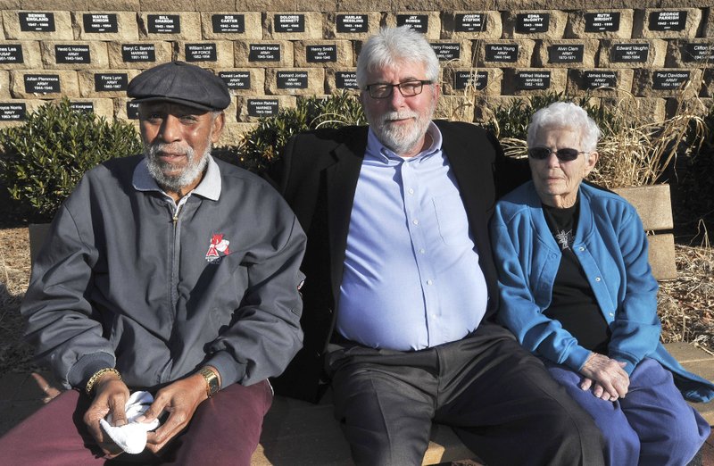 Kriss Schaffer, then-director of the Fayetteville Veterans home (center), sits with two of the residents of the home, Tyrone Leffall and Therese Moore in January 2014 at the Fayetteville Veterans Home garden. Schaffer resigned Tuesday.