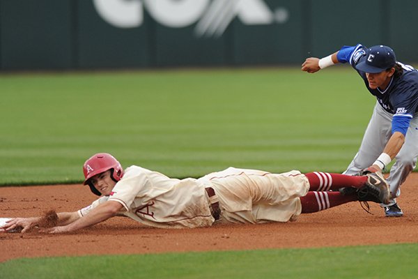 Arkansas first baseman Clark Eagan is tagged out by Creighton shortstop Nicky Lopez Tuesday, April 19, 2016, during the first inning at Baum Stadium in Fayetteville.