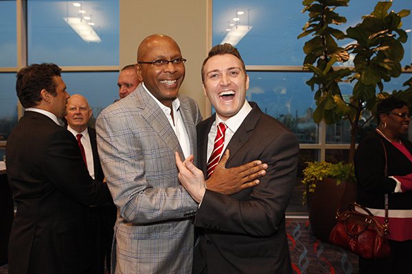 Former Arkansas basketball players Darrell Walker, left, and Pat Bradley greet each other prior to the Arkansas Sports Hall of Fame induction banquet Friday, March 4, 2016, at the Statehouse Convention Center in Little Rock. 