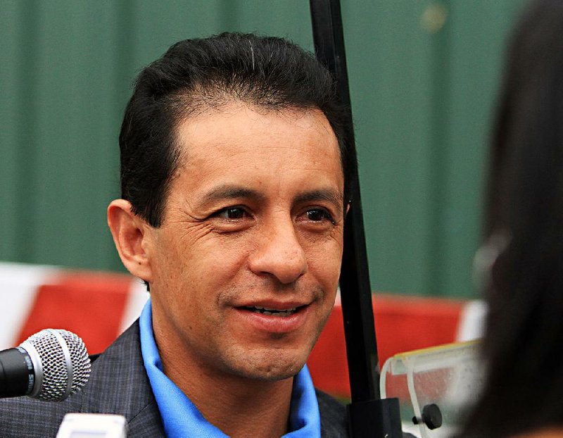 Winning Preakness jockey Victor Espinoza talks to the media outside the stakes barn Sunday, May 17, 2015 at Pimlico Race Course in Baltimore.  