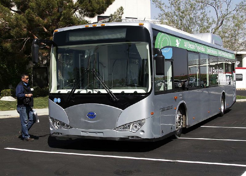 A bus produced by China’s BYD Co. is parked in a lot in Lancaster, Calif., in this file photo. BYD sold more electric cars last year than Tesla, Nissan or GM. 