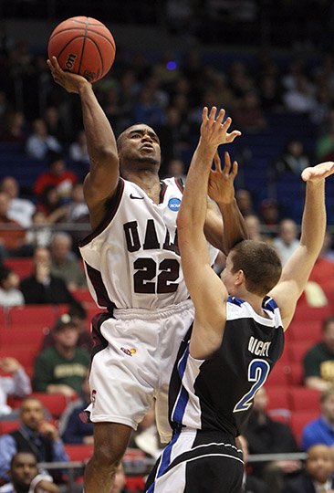 Arkansas Democrat-Gazette/Stephen B. Thornton COMING HOME: Solomon Bozeman (22) goes up for a basket as UALR faces North Carolina-Asheville in a First Four game of the 2011 NCAA tournament in Dayton, Ohio. Sun Belt Conference player of the year as a senior, Bozeman has joined new UALR head coach Wes Flanigan's staff, it was announced Wednesday. Bozeman comes from Abilene Christian, where he coached two years after a professional career.