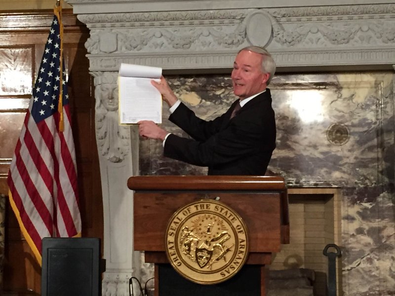 Gov. Asa Hutchinson vetoes amended language in Medicaid legislation Thursday, April 21, 2016, that would have ended funding for his Arkansas Works program by Dec. 31.
