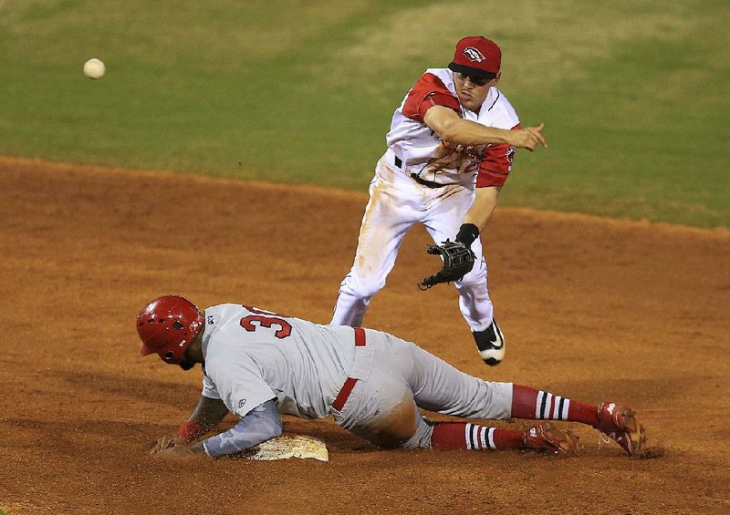 Arkansas Travelers second baseman Alex Yarbrough throws to first base after forcing out Springfield baserunner David Washington on Thursday at Dickey-Stephens Park in North Little Rock. The Travelers won 9-4.