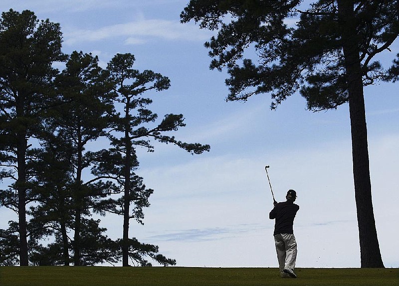 Arkansas Democrat-Gazette/BENJAMIN KRAIN --4/21/2016--
A golfer plays at War Memorial Golf Course on Thursday. The Little Rock Parks and Recreation Department operates the public course and plans to convert the grass on the greens to Champion Ultradwarf Bermudagrass over the summer months and will have to close the course from May 9 through August 12 to make the improvements. The city's other public golf courses, Rebsamen and Hindman, have already converted to Championship Ultradwarf Bermudagrass, and this will be the first upgrade to War Memorial in more than 20 years.