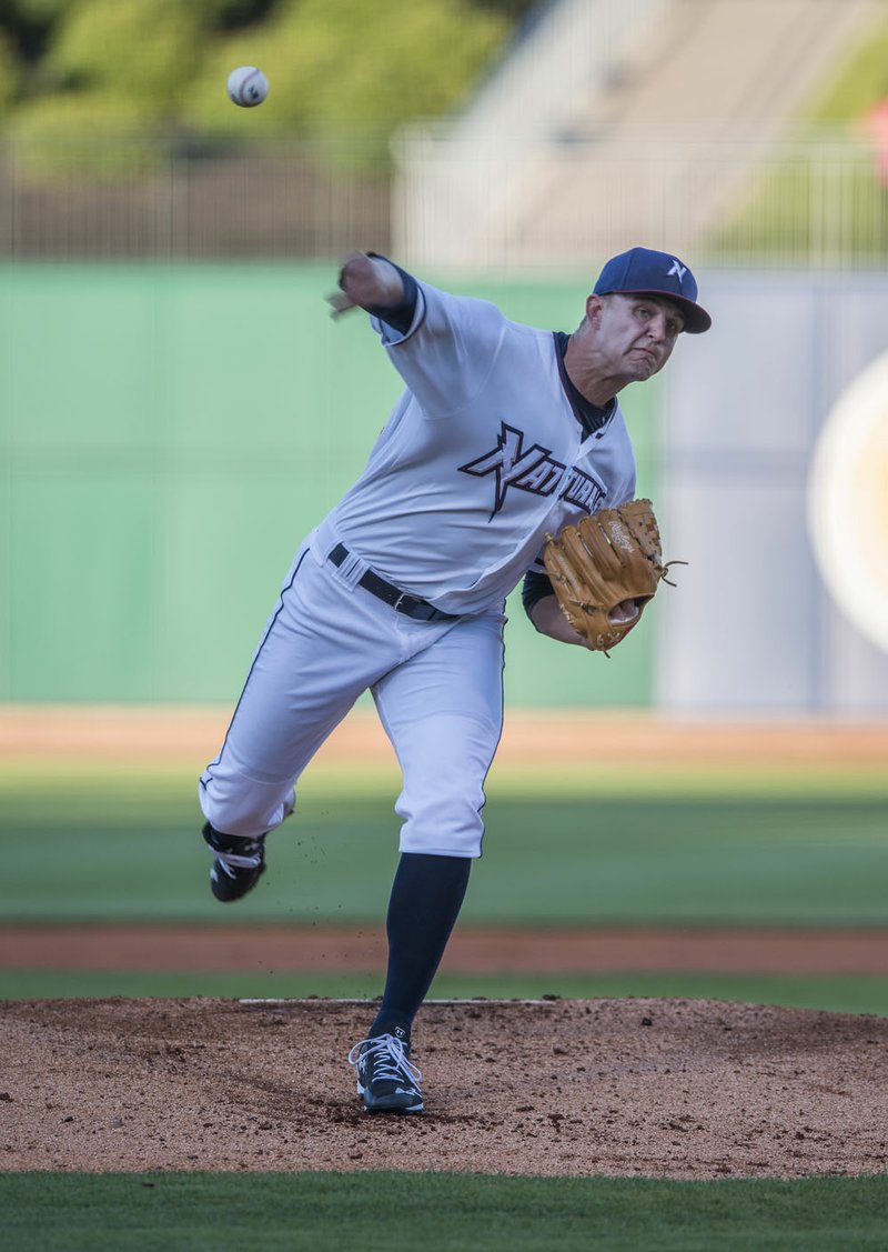 Christian Binford (19) of the Northwest Arkansas Naturals pitches Thursday against the Tulsa Drillers at Arvest Ballpark in Springdale.