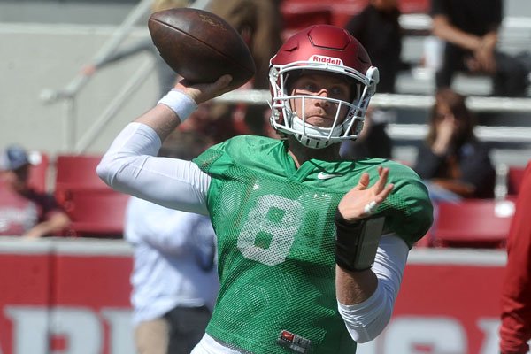 Arkansas quarterback Austin Allen (8) runs drills Saturday, April 9, 2016, during practice at Razorback Stadium.