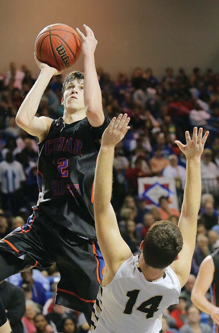 Cedar Ridge’s Austin Reaves shoots over Charleston’s Wade Gerlick during the Class 3A state championship game March 12 in Hot Springs. Reaves is the 2016 Three Rivers Edition Boys Player of the Year.