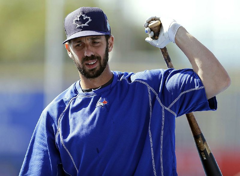 In this March 23, 2016, file photo, Toronto Blue Jays' Chris Colabello loosens up before a spring training baseball game against the New York Mets in Dunedin, Fla.