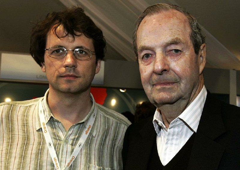 In this file photo, dated Saturday May 14, 2005, Frederick Baker, the Anglo-Austrian director of "Shadowing The Third Man", left, and Britain's Guy Hamilton, director of four James Bond films, pose prior to their joint press conference at the 58th international Cannes film festival in Cannes, southern France. 
