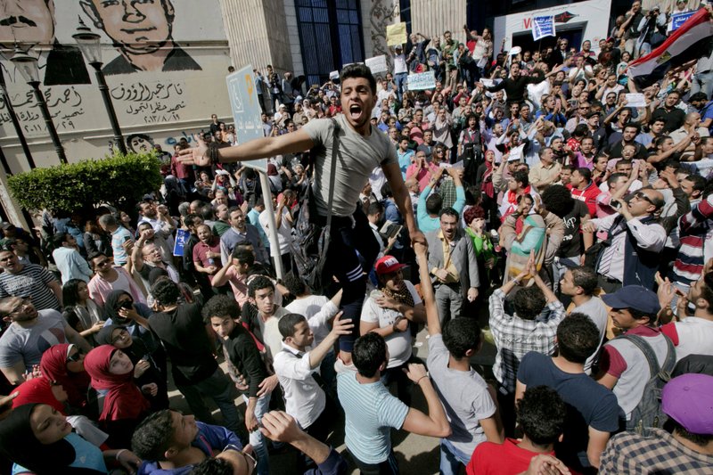 In this Friday, April 15, 2016 file photo, Egyptians shout slogans against Egyptian President Abdel-Fattah el-Sissi during a protest against the decision to hand over control of two strategic Red Sea islands to Saudi Arabia in front of the Press Syndicate, in Cairo, Egypt. 