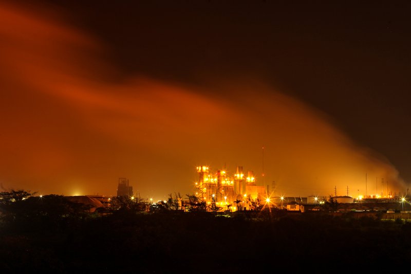 A plume of smoke rises over the State oil company Petroleos Mexicanos' petrochemical plant in Coatzacoalcos, Mexico, Wednesday April 20, 2016.  