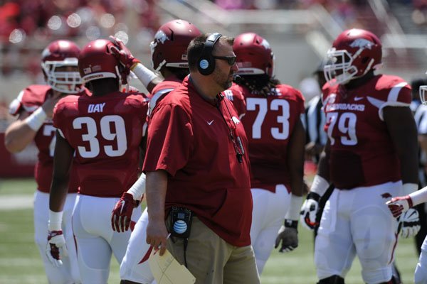 Arkansas coach Bret Bielema speaks to his team Saturday, April 23, 2016, during the annual spring Red-White game in Razorback Stadium.