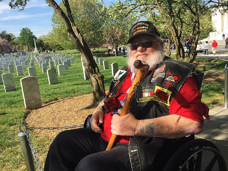 James Dickey, a Vietnam veteran from Westville, Okla., visits Arlington National Cemetery outside Washington on Wednesday. 
