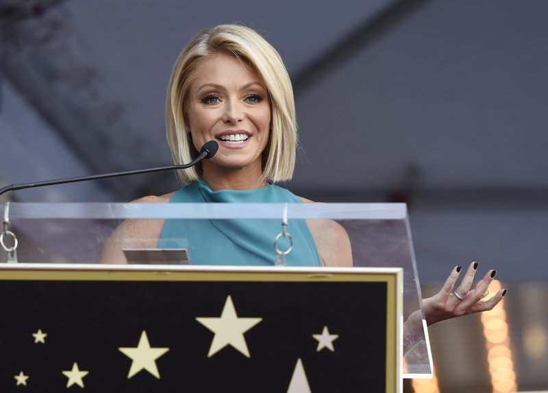 FILE - In this Oct. 12, 2015 file photo, Kelly Ripa addresses the crowd during a ceremony honoring her with a star on the Hollywood Walk of Fame in Los Angeles. Ripa is returning to her daytime talk show, ending an absence that followed word her co-host, Michael Strahan, will join &quot;Good Morning America.&quot; She will be back Tuesday, April 26, 2016 on &quot;Live With Kelly and Michael,&quot; she said in an email to the show's staff that was obtained by The Associated Press.(Photo by Chris Pizzello/Invision/AP)