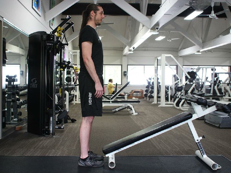 Paul Fajer does step 1 of the Close Grip Pushup on Decline Bench.