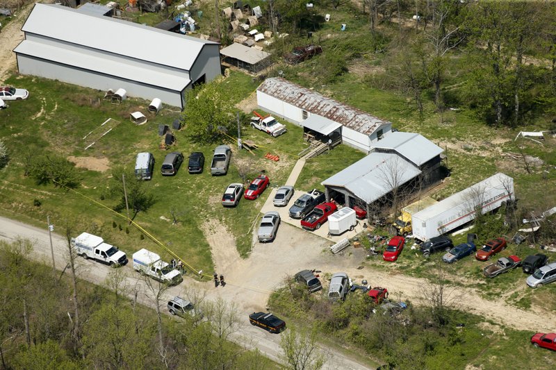 This aerial photo shows one of the locations being investigated in Pike County, Ohio, as part of an ongoing homicide investigation, Friday, April 22, 2016. Several people were found dead Friday at multiple crime scenes in rural Ohio, and at least most of them were shot to death, authorities said. No arrests had been announced, and it's unclear if the killer or killers are among the dead. (Lisa Marie Miller/The Columbus Dispatch via AP) MANDATORY CREDIT