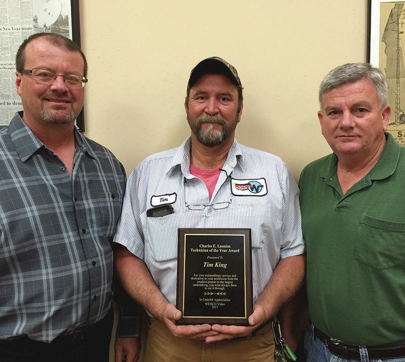 Submitted photo Tim King, with Resort TV Cable, was presented with the prestigious Charles E. Launius Technician of the Year Award. The award is presented by the corporate engineering staff to a field technician in WEHCO Video Cable TV Operations. King is a senior maintenance technician. The award is based on field expertise, commitment to Resort TV Cable operations and excellence in field work. From left are Chuck E. Launius, King and Charles Hill.