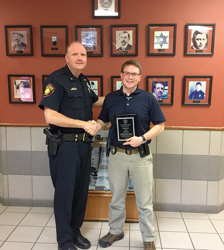 Submitted photo Hot Springs Interim Police Chief Jason Stachey, left, presented Detective Kenney May with the Hot Springs Police Department's Employee of the Quarter Award. May was nominated for this award by several supervisors at the department.