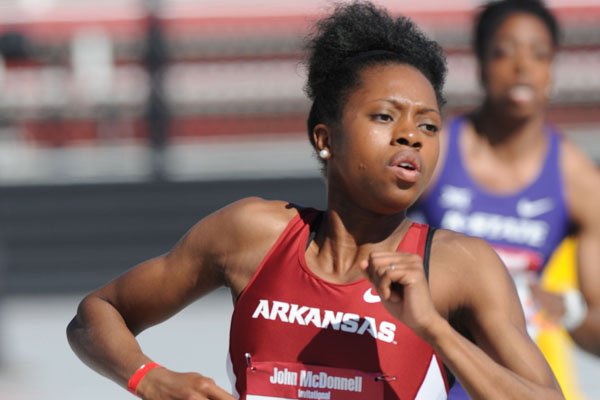 Arkansas' Monisa Dobbins takes off Saturday, April 23, 2016, while competing in the 400 meters during the John McDonnell Invitational at John McDonnell Field in Fayetteville.