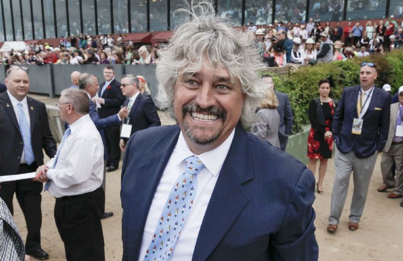 Trainer Steven Asmussen smiles after Creator won the Arkansas Derby horse race at Oaklawn Park in Hot Springs, Ark., Saturday, April 16, 2016. 