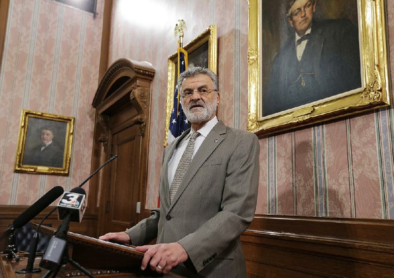 Mayor Frank Jackson answers questions about a settlement in a police shooting during a news conference Monday, in Cleveland.