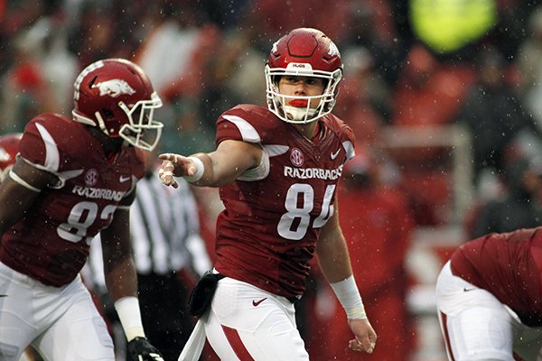 In this Nov. 27, 2015, file photo, Arkansas' Hunter Henry (84) points to his teammate during the first half of an NCAA college football game against Missouri in Fayetteville, Ark. (AP Photo/Samantha Baker)