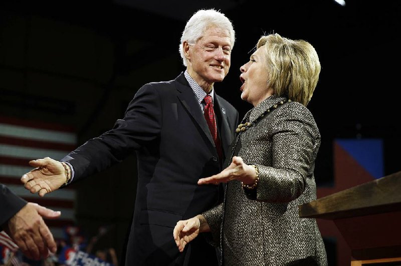 Hillary Clinton celebrates with her husband, former President Bill Clinton, at a rally Tuesday night in Philadelphia, where she called on Bernie Sanders’ supporters to help unify the Democratic Party. 